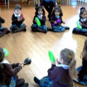 Early Years playing percussion