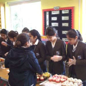 Students eating cakes