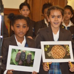 Students with photos in their hands