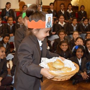 Students holding cake