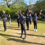 Students jumping up and down in the air