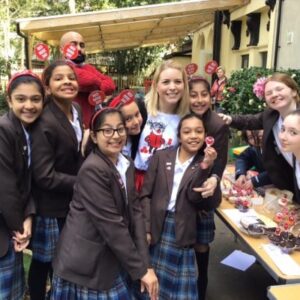 Students outside enjoying cakes