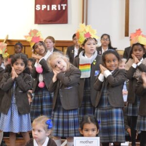 Students singing and smiling