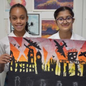 Students holding painting