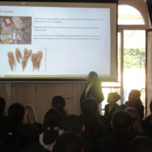 Student discussing a slideshow
