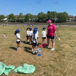 students and teacher playing